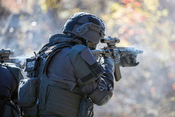 istock Swat Police Officer Shooting With Firearm 925123682