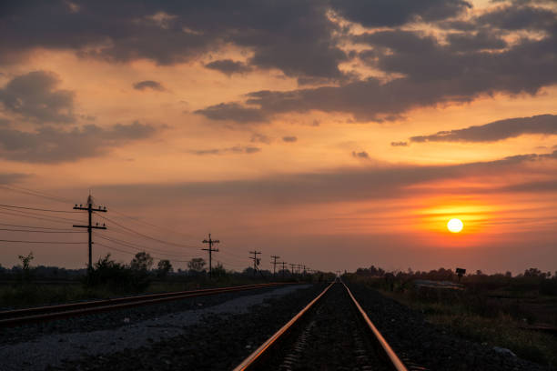 istock Vintage railroad tracks and sunset 925126962