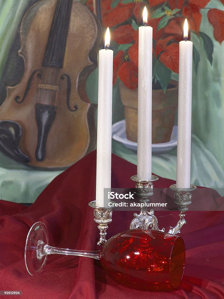 Christmas arrangement Candelabra and wine glass arrangement with one of my Still Life paintings in background Arrangement Stock Photo