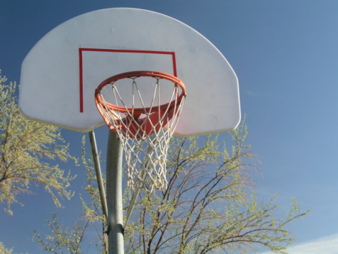 Outdoor Basketball Hoop and Backboard with a Blue Sky background