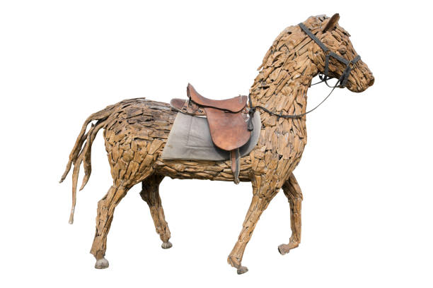 istock Wooden horse with saddle isolated on white background 925133924