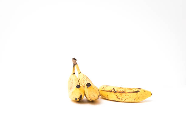 istock Overripe bananas on isolated white background 925135396