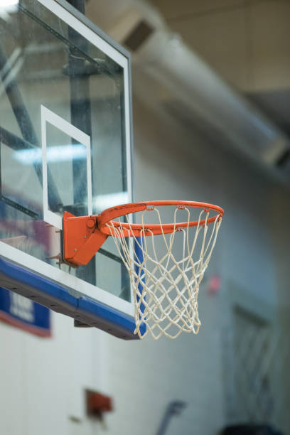istock Empty basketball goal in gym 925135442