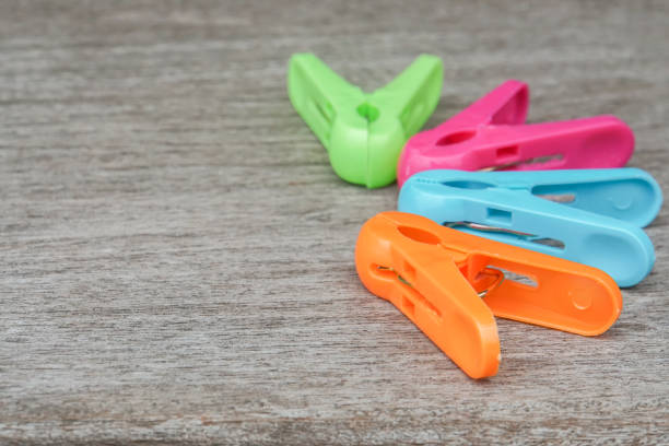 istock plastic clothespin in many colors on wood background 925135590