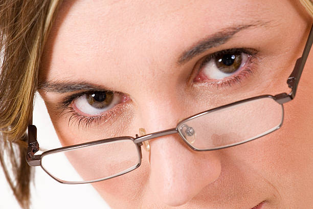 istock Businesswoman staring over glasses 92514157