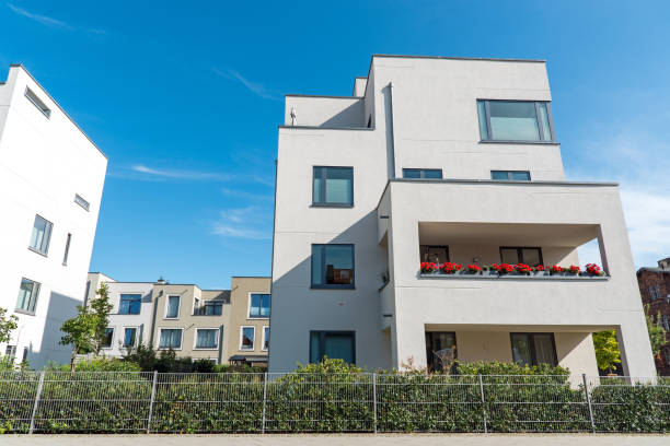 istock White modern houses in front of a blue sky 925147470