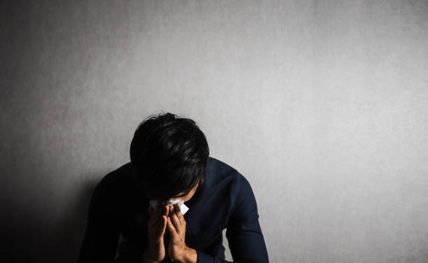 istock Man holding tissue paper on his nose. sick or crying 925147968