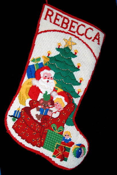 Christmas Stocking - Rebecca Hand crafted Christmas stocking on black background mickey mantle stock pictures, royalty-free photos & images