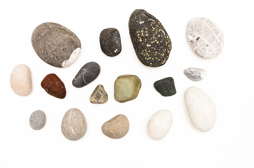 Set of Pebbles sea stones isolated on white background. Top view.