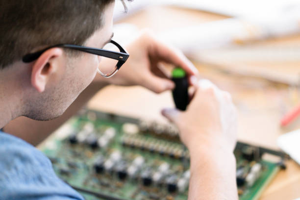 istock Male computer engineer repairing circuit board 925159306