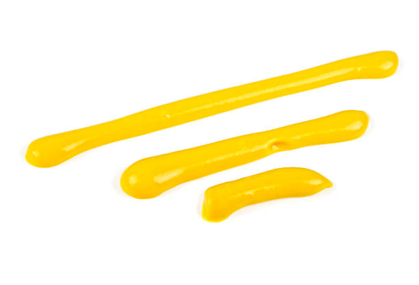 istock Mustard sauce. Strips of mustard on a white background. 925160944