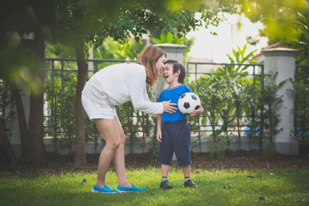istock Asian mother and son Playing Soccer 925163336