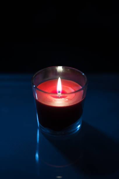 istock The red Candle with Dark Background 925163510