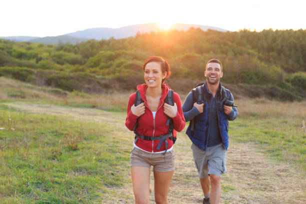 istock Couple backpackers hiking in nature 925163620