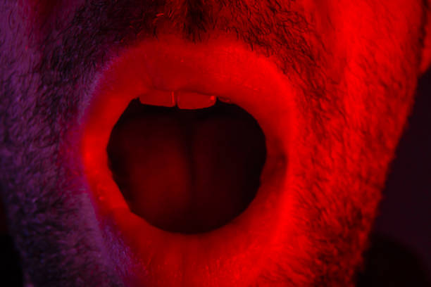 istock Macro closeup on man with surprised facial expression with opened mouth 925164204