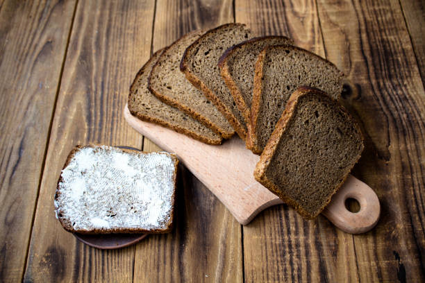 istock corn bread cut into pieces and butter on a wooden background 925164572