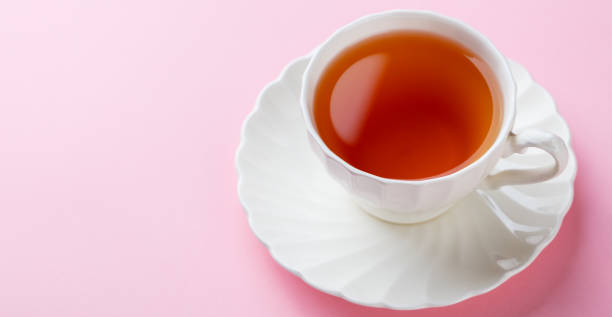istock Tea in white cup on pink background. Copy space. 925164692