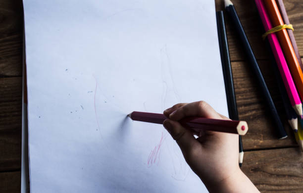 istock little boy draws on white paper 925164698
