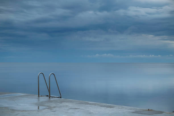 istock bathing ladder by the sea 925171604
