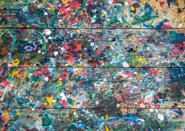 istock color painting drop on wood from top view 925172112