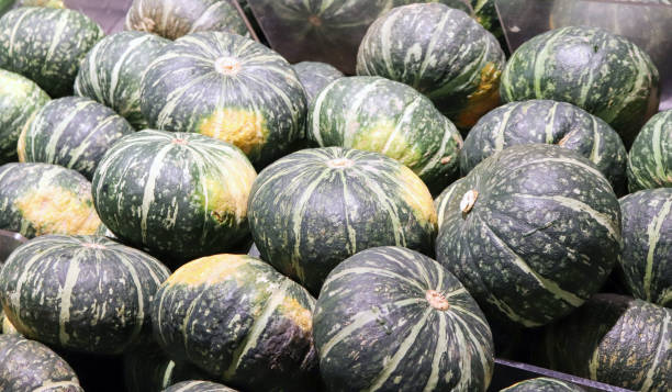 istock Pumpkins on display at the mart. 925172708