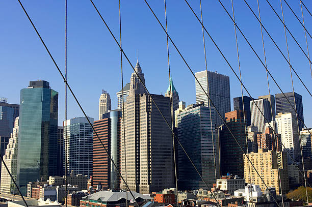 istock View of lower Manhattan through suspension cables 92517292