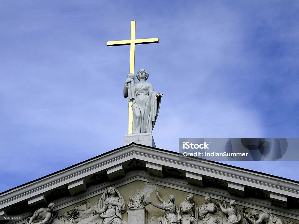 Statue with golden cross  Apostle - Worshipper Stock Photo