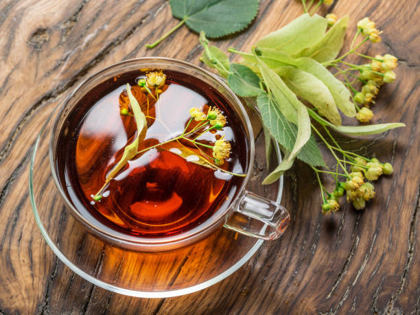 istock Cup of linden tea and lime flowers. 925176392