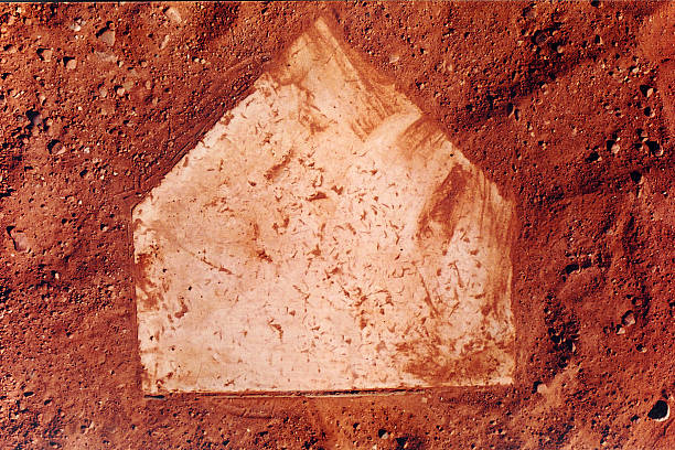 istock Home Plate on a Baseball field with red dirt 92517651