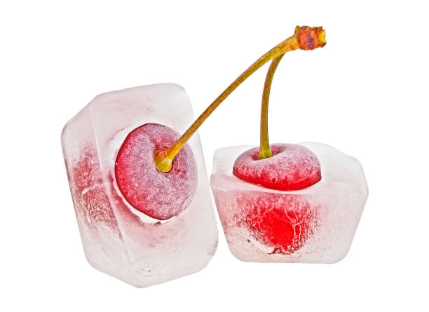 istock Two cherries in ice cubes on a white background 925184344