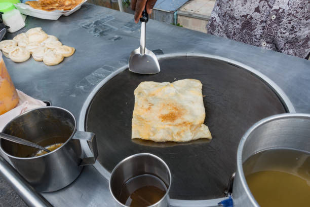 istock roti on big pan made by roti maker 925184576
