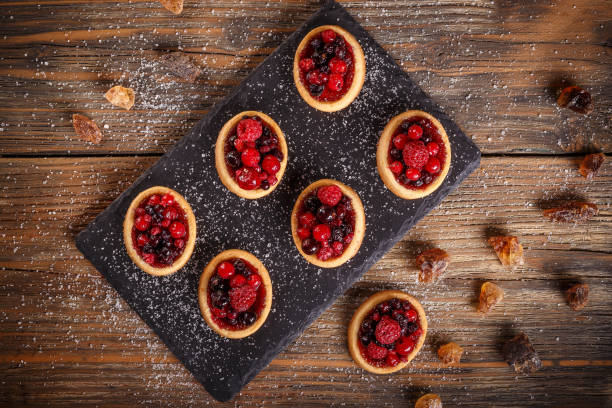 Top view of shortcake pies on rustic wooden table