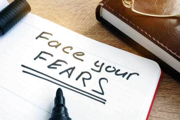 istock Face your fears written in a note. 925184866