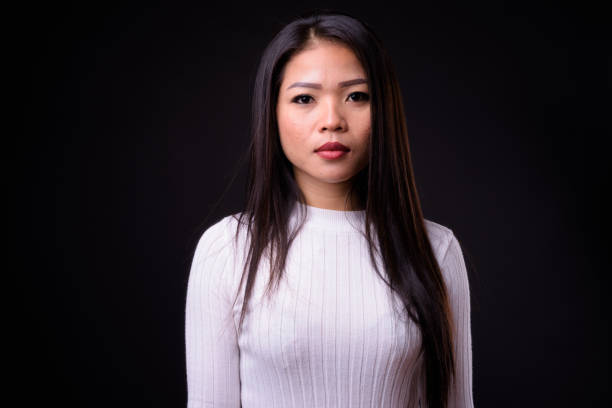 istock Beautiful Asian woman against black background 925185080