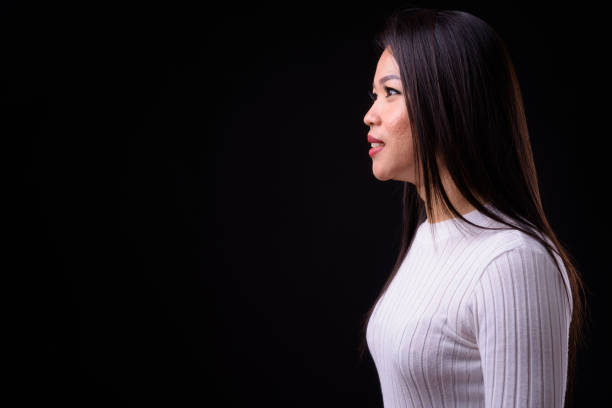 istock Beautiful Asian woman against black background 925185236