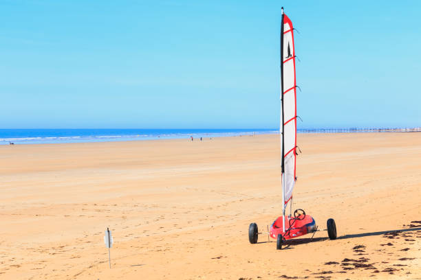 Erquy, France, June 25, 2022- Beach sailing on the Atlantic beach of Erquy in Brittany.