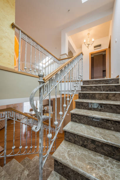 istock Marble stairs with wrought iron stair railing in luxury villa 925192942