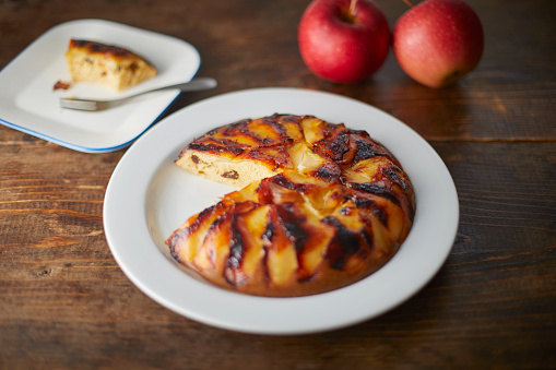 An apple pancake on a white dish