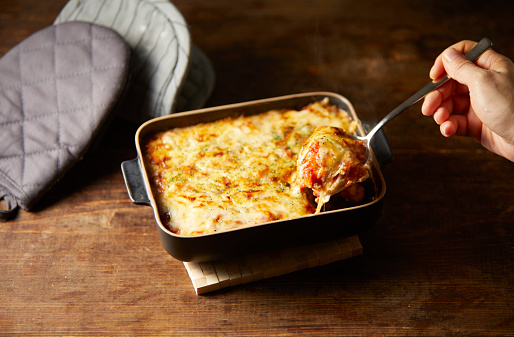 Cupping lasagna with a spoon