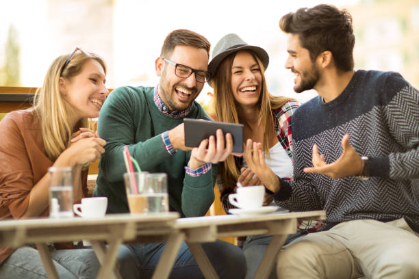 istock Group of four friends having fun a coffee together 925193276