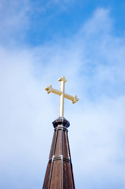 istock Church cross aginst a blue sky 92519373