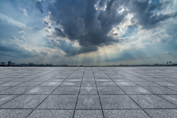 istock Empty brick road front of office building under blue sky 925194154