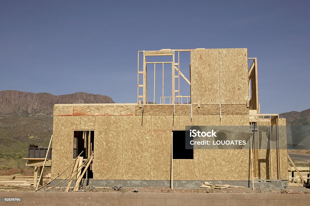 New house under construction New house under construction in the desert with mountain view. Boarding Stock Photo