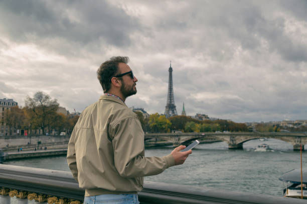 istock Modern guy using cellphone in the European city. 925199422