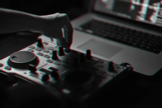 istock DJ mixer disco illuminated by searchlights 925199830