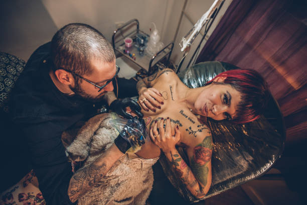 istock Woman loving tattoos 925202482