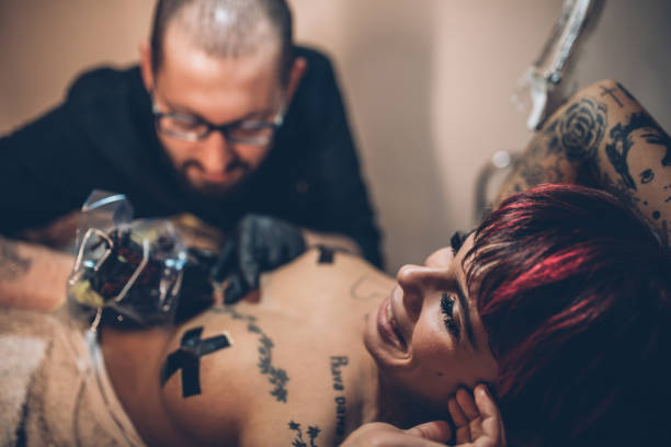 istock Woman getting a new tattoo 925203726