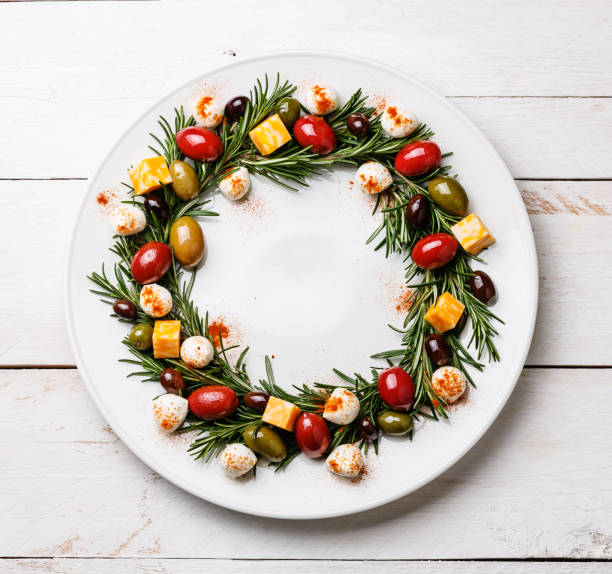 istock Rosemary wreath christmas appetizer with cheese and olives 925206118
