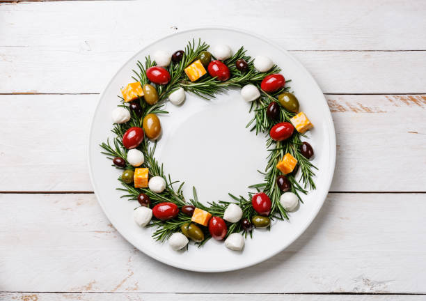 istock Rosemary wreath christmas appetizer with cheese and olives 925206126