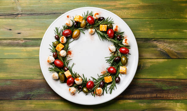 Rosemary wreath christmas appetizer with cheese and olives